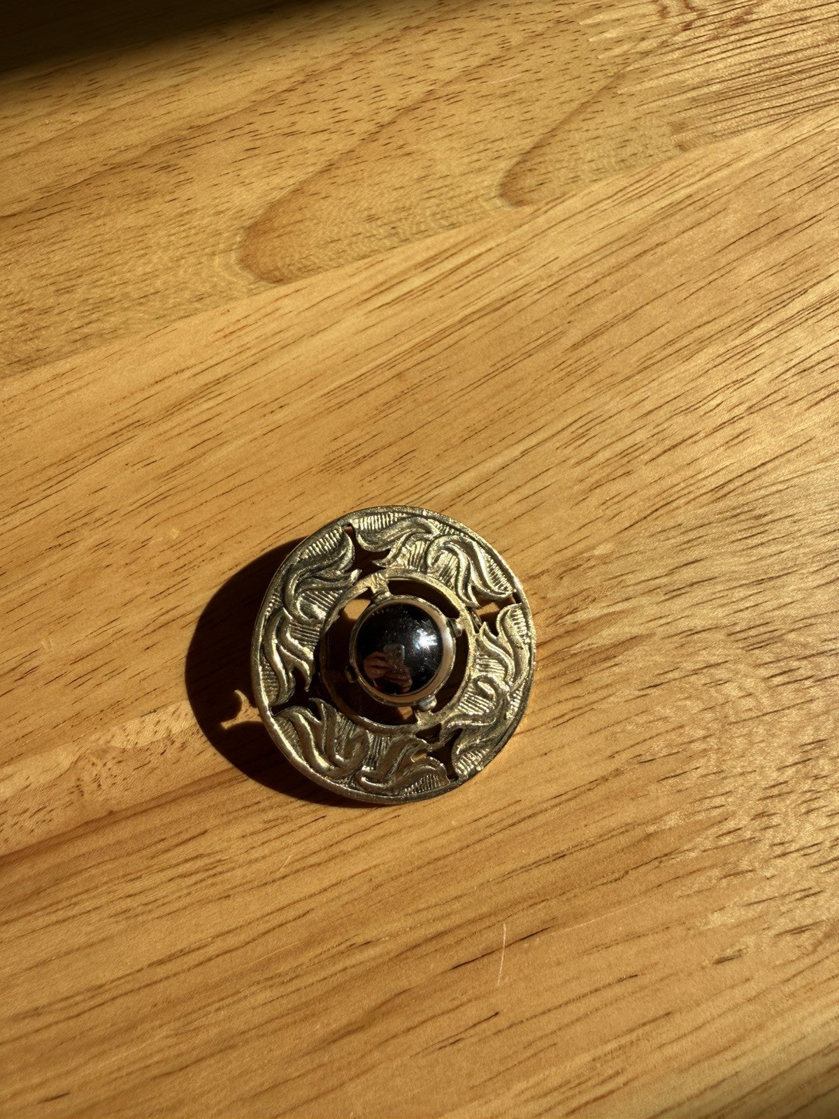 Vintage Gold Tone Round Filigree Patterned Dark Centre Stone Clip On Brooch